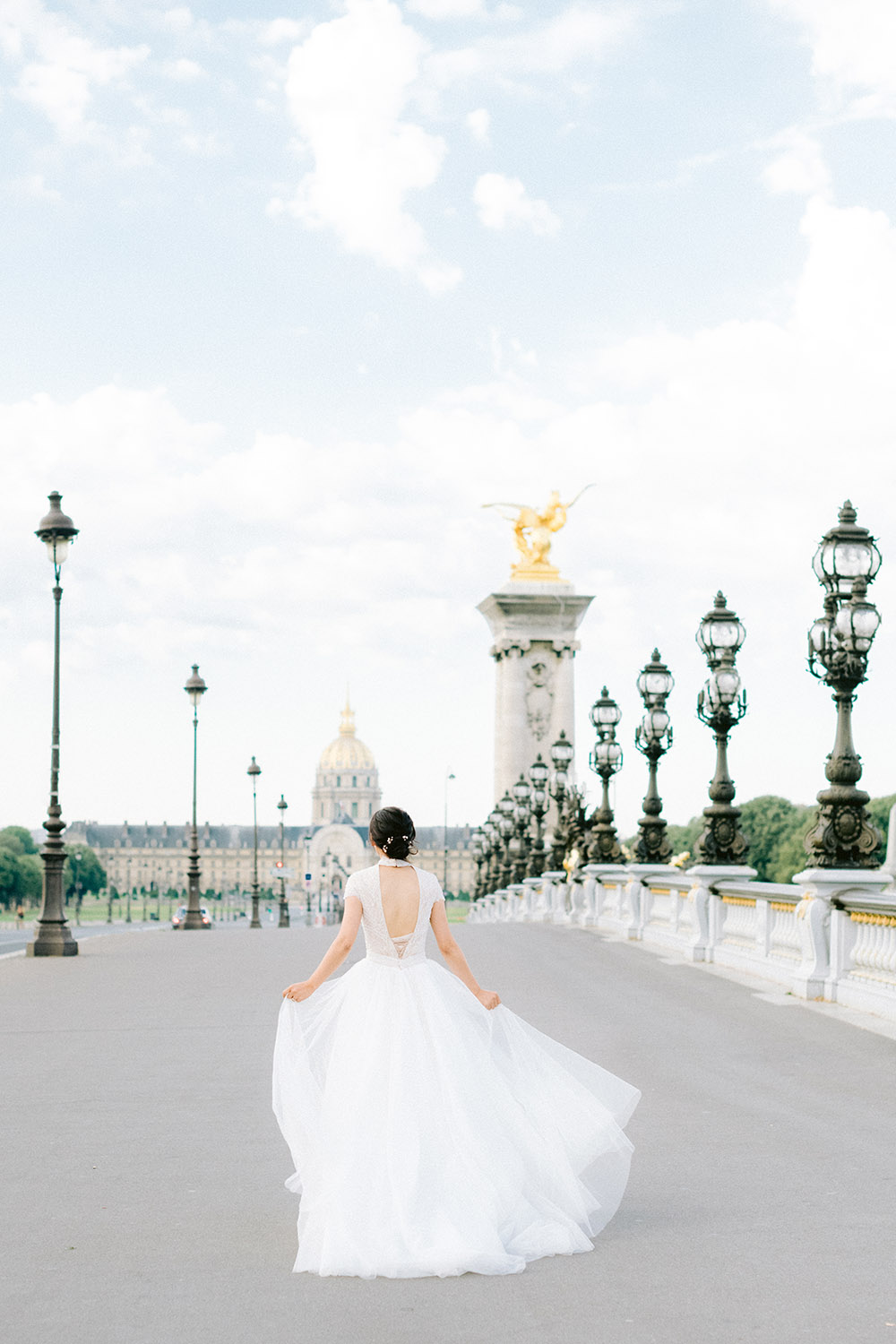 Bride running on Alexander III Bridge